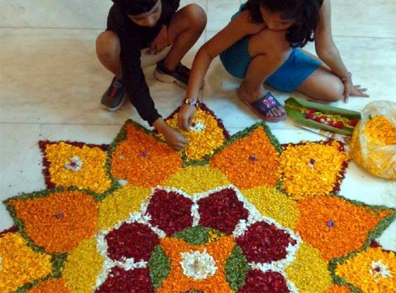 small-kids-making-rangoli-with-flowers