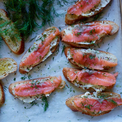 David Tanis preparing salmon toast in kitchen. LeeHudson_Thanksgiving_FW_Nov2012